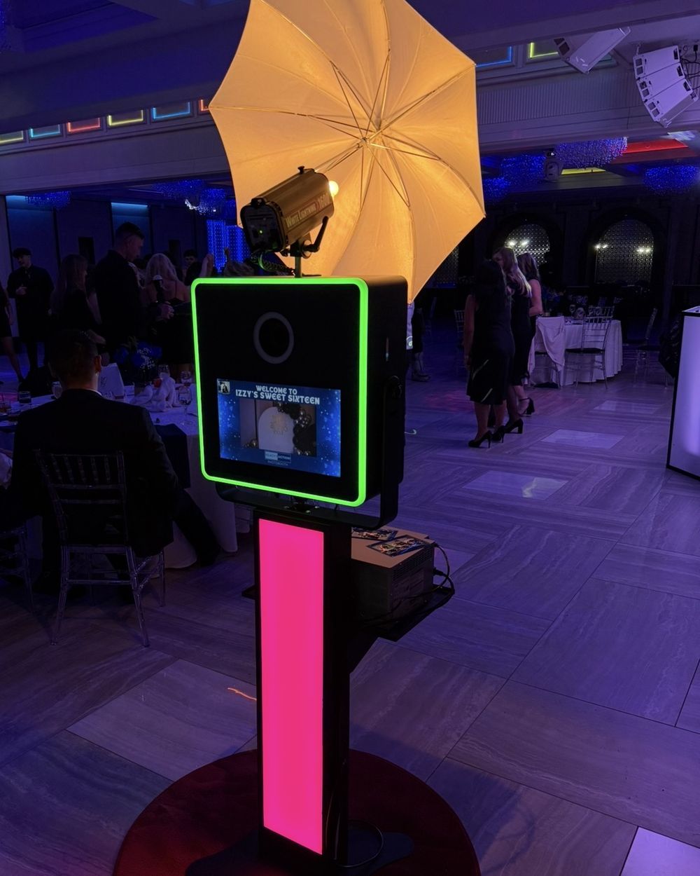 Open-air photo booth setup with LED lighting and umbrella flash at a New Jersey venue